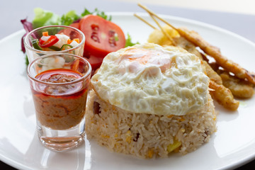 Fried rice with fried egg With roasted pork and salad