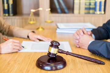 business people and lawyers discussing contract papers sitting at the table. Concepts of law, advice, legal services