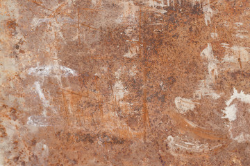 old, rusty metal surface with dirty white traces