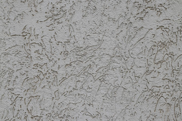 gray, decorative, facade plaster. Close view, interesting ornament, texture. Protective coating, facade protection, construction, construction and finishing works.