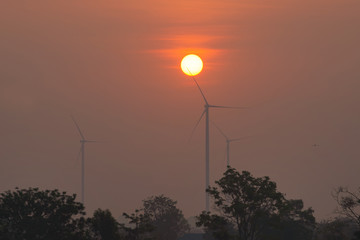 Fototapeta premium Wind turbines with sunset, Renewable Energy and Energy Production with clean