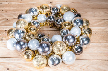 Christmas Wreath Composed of golden balls with sparkle.