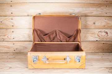 Ancient luggage on wood floor background is wood