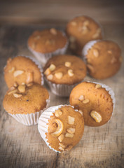Small cake made from banana milk powder on wooden floor.