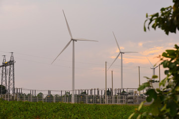 Windmills and electrical substation,  high-voltage substation and wind turbines.