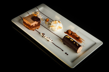 handmade chocolate creamy dessert on rectangle plate