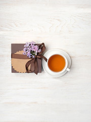 Fototapeta na wymiar gift box and cup of tea on white background. concept gift for dad, men, brutal style. concept father's day idea. top view, copy space