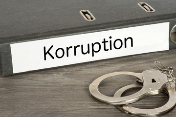 Handschellen und Ordner Korruption