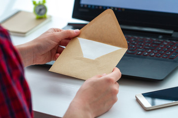 Get the written message and open envelope with a letter. Receive and send written correspondence.