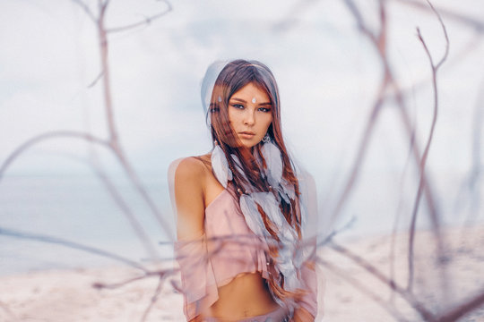 Beautiful young boho style woman portrait outdoors. Double exposure