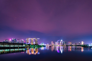 Fototapeta na wymiar SINGAPORE-MAY 18, 2019 : Cityscape Singapore modern and financial city in Asia. Marina bay landmark of Singapore. Night landscape of business building and hotel. Panorama view of Marina bay at dusk.