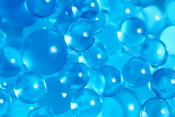 Water blue gel balls. Polymer gel. Silica gel. Balls of blue hydrogel. Crystal liquid ball with reflection. Texture background. Close up macro