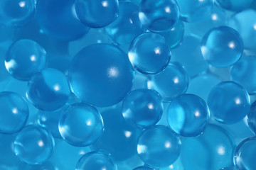 Water blue gel balls. Polymer gel. Silica gel. Balls of blue hydrogel. Crystal liquid ball with reflection. Texture background. Close up macro