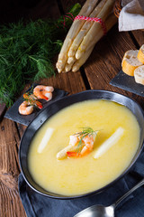 Super delicious asparagus soup with crab and capers .