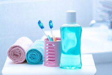 Toothbrushes and mouthwash in the bathroom for oral hygiene, health of teeth and gums. Fresh breath. Teeth care.