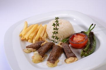 rolled beef steaks filled with cheese with salad and french fries