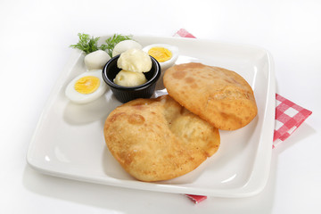 afried borek called turkish cuisine made with raw ground meat, onions, and spices served with eggs
