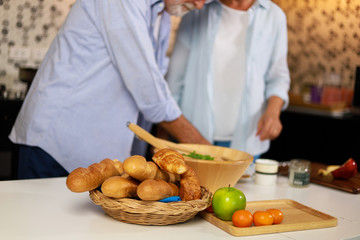Senior couple Man and woman cooking in kitchen happy mood