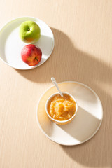 Natural baby food concept. Bowl of apple baby puree.