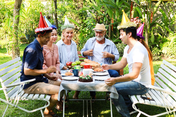 Senior Man birthday party in garden