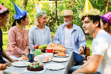 Senior Man birthday party in garden