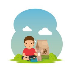 Naklejka premium cute little boy with dog and food bag in the landscape