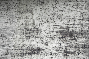 Abstract old scratched smoked metal texture with shaded edges, grunge background.