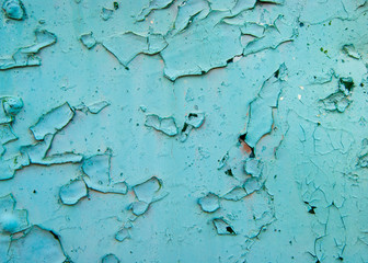 Old age, vintage, metal corrosion, layers of old peeling paint on an old iron trailer