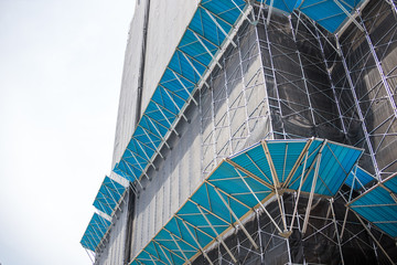 Chiba, Japan, 05/05/2019 , Chiba port tower. construction site with super ordered and clean scaffolding, with extra protection to avoid falling objects..