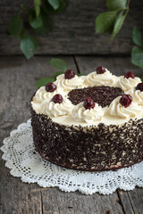 Black forest cake, Schwarzwald pie, dark chocolate and cherry dessert on wooden background