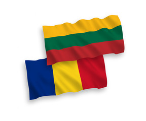 National vector fabric wave flags of Lithuania and Romania isolated on white background. 1 to 2 proportion.