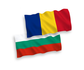 National vector fabric wave flags of Bulgaria and Romania isolated on white background. 1 to 2 proportion.