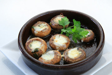 mushrooms filled with cheese white background