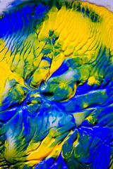 Fototapeta na wymiar Dynamic fluid color paint splashes background. Blue and orange mixed liquid backdrop. Abstract marbling effect. Dynamic fluid