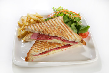 toast with side dishes french fries and salad