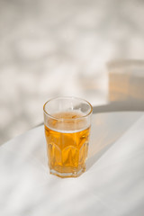 A glass of beer on the table.