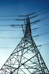 Electricity pole against blue sky clouds in dawn time, Transmission line of electricity to rural, electricity transmission pylon