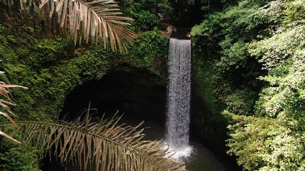 Tibumana waterfall Bali Indonesia film from drone