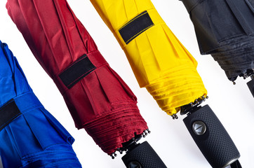Colorful unfolded windproof umbrellas isolated on white