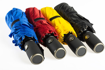 Colorful unfolded windproof umbrellas isolated on white