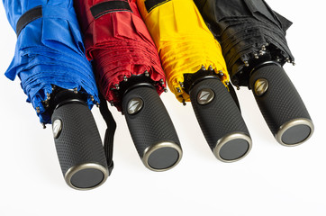 Colorful unfolded windproof umbrellas isolated on white