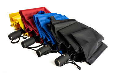 Colorful unfolded windproof umbrellas isolated on white