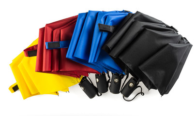 Colorful unfolded windproof umbrellas isolated on white