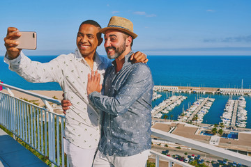 a gay couple using a mobile phone