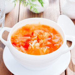 vegetable soup with onions and cabbage for onion diet in a white bowl, selective focus