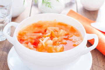 vegetable soup with onions and cabbage for onion diets in a white bowl, horizontal