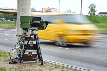 Mobile speed camera on highway. Police radar installed on roadside to control speed limit. Police radar on the road. Automatic radar photographs cars driving too fast