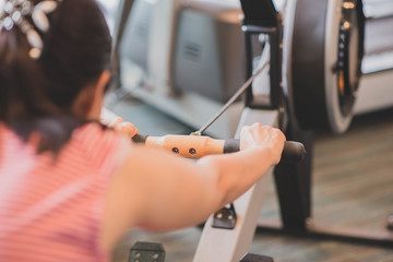 Asian woman work out exercise at Gym weight loss