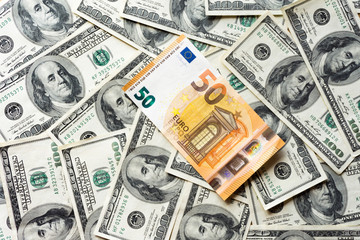 Pile of old one hundred dollar and euro bills, close up dollars euro