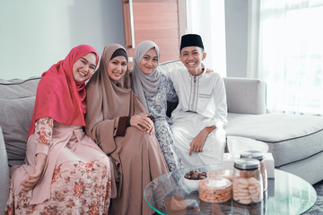 beautiful asian muslim family portrait smiling to camera